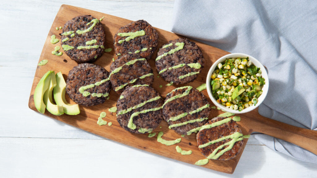 Black Bean and Brown Rice shaped and fried cakes with avocado sauce