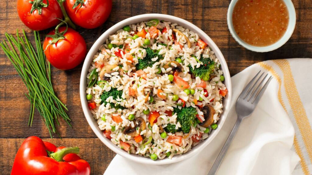 Layered Mediterranean Rice Salad with tomatoes