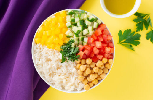 Salad bowl with Rice, cucumber, tomatoes, yellow bell peppers and chickpeas