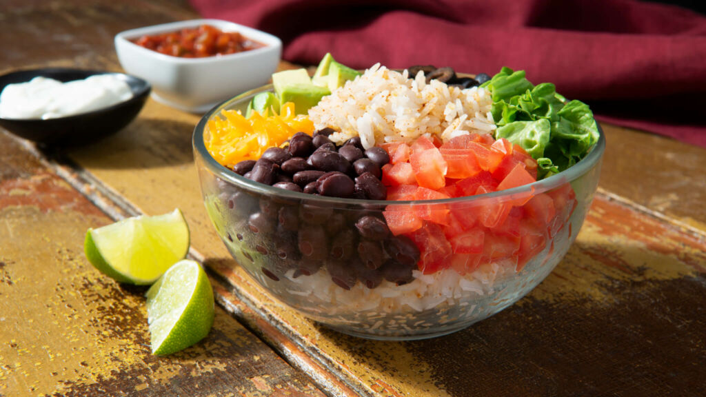 Bowl with rice, black beans, quinoa and vegetables