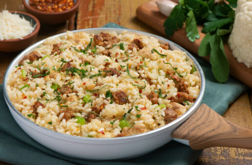 Risotto dish with sausages, cauliflower and parsley