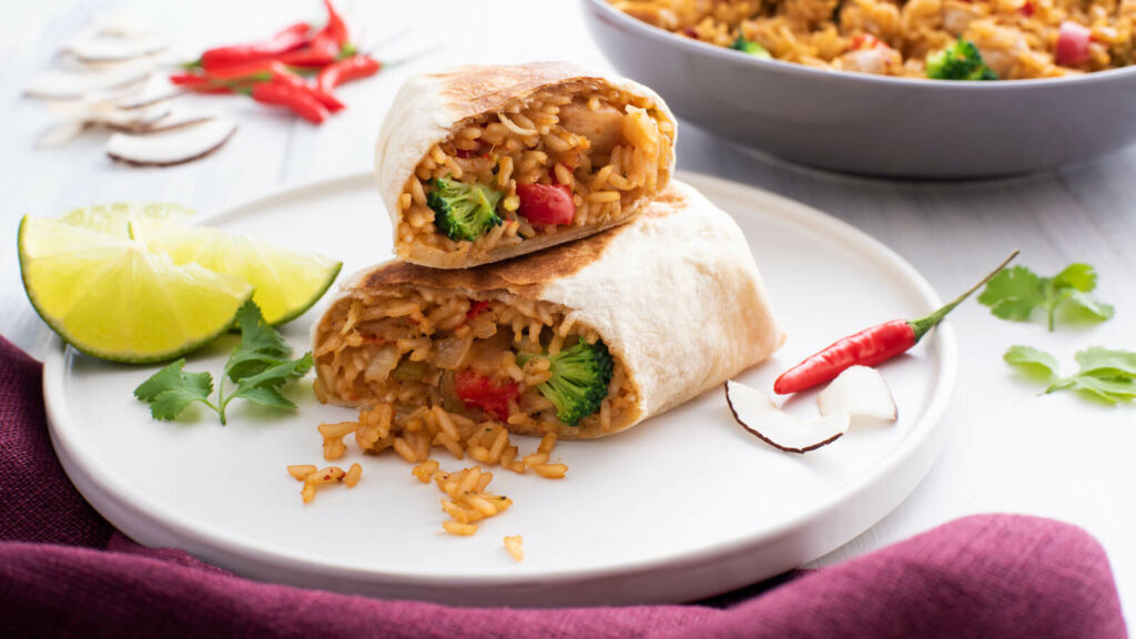 Rice filling with broccoli and red peppers wrapped in a tortilla