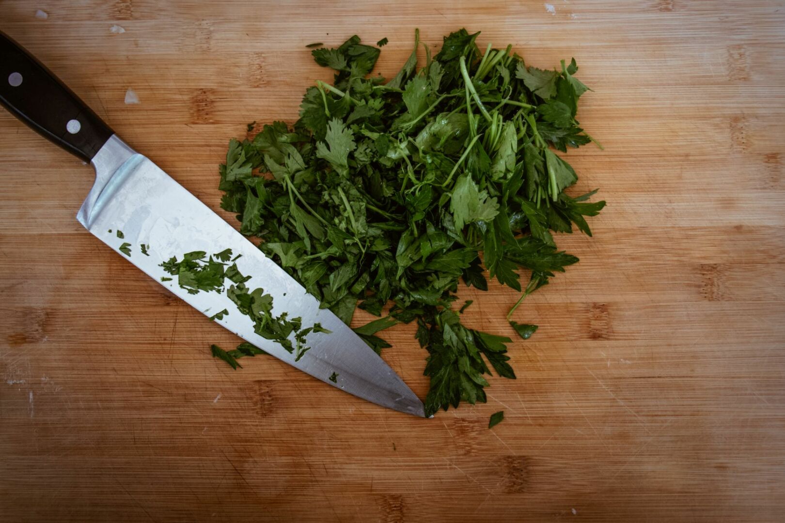 Chopped parsley with a large knife