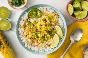 mexican-grilled-street-corn-with-white-rice-jalapenos-and-lime-wedges